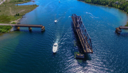 OPENING SWING BRIDGE WITH BOATS. MANITOULIN ISLAND, ONTARIO CANADA