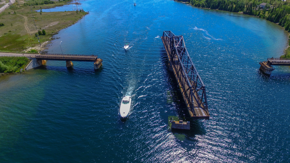 OPENING SWING BRIDGE WITH BOATS. MANITOULIN ISLAND, ONTARIO CANADA