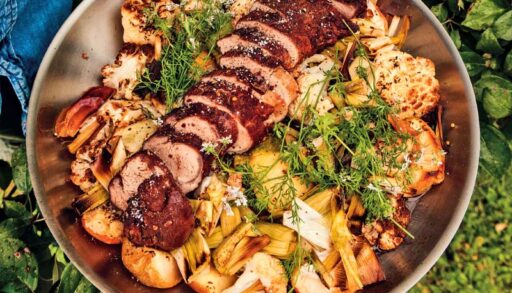 Michael Smith's pan-roasted vegetables with cinnamon-crusted pork tenderloin in a stainless steel pan
