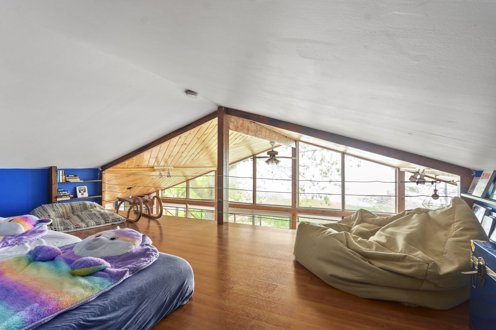 A loft area with bean bag chairs