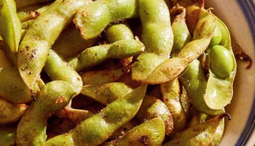 Grilled ginger-garlic edamame in a bowl