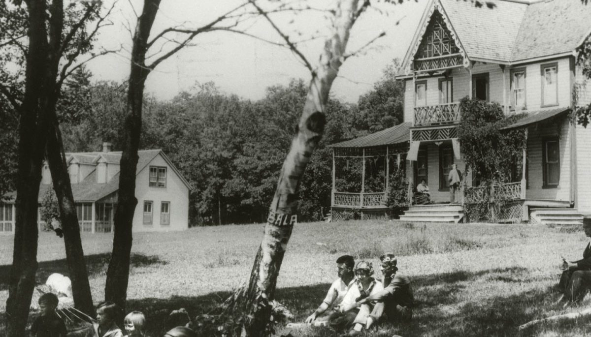 L.M. Montgomery on the veranda of the cottage she stayed at in Bala, Ont.